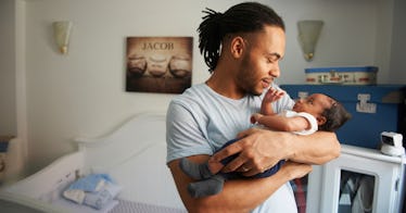 dad holding his newborn baby