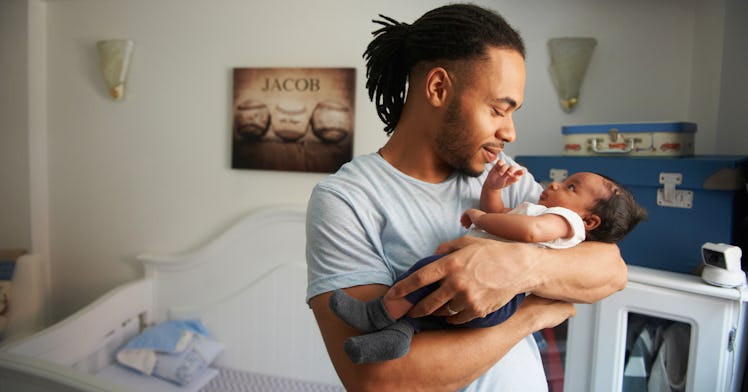 dad holding his newborn baby