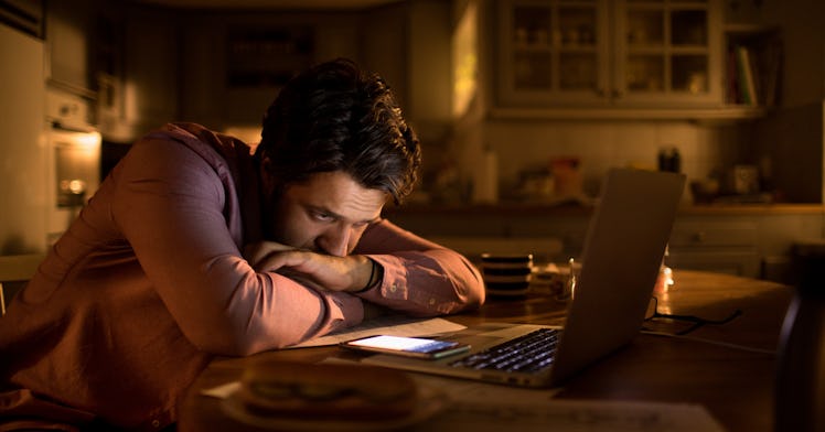 man on computer stressing