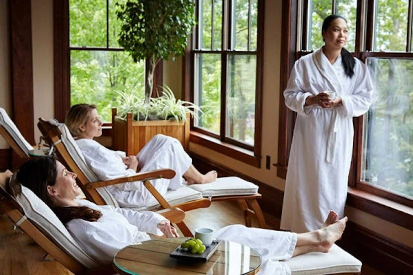 Three people lounging in bathrobes at Mohonk Mountain House