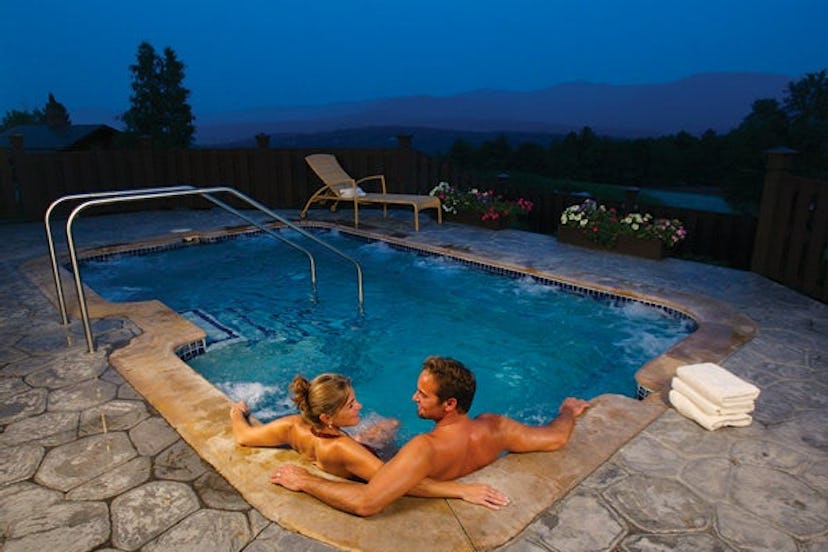 A couple in a hot tub at Trapp family Lodge