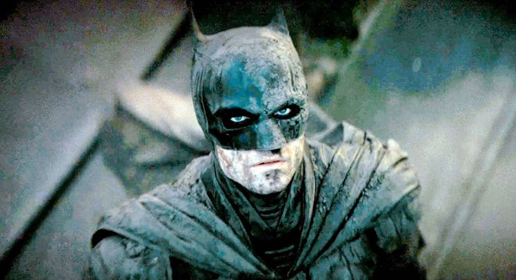 Batman in dust and dirt during a movie scene