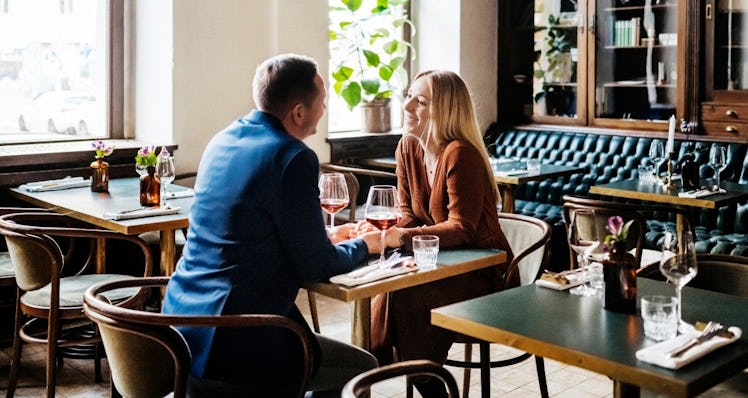 Couple on date drinking wine in restaurant