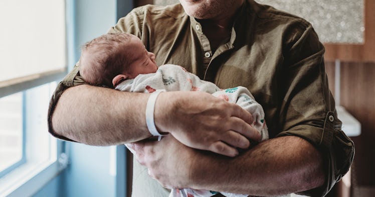 dad holding baby
