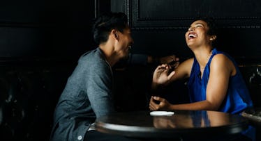Couple on date night laughing and talking