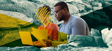 A couple sitting next to each other looking over papers, the woman's face is scribbled over hiding i...
