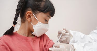 A child receives the COVID booster vaccine.