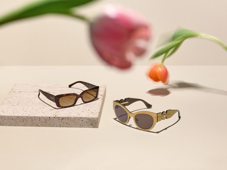 Ray-Ban Stories Wayfarer glasses on a white table with tulips above them as the fail-proof mother da...