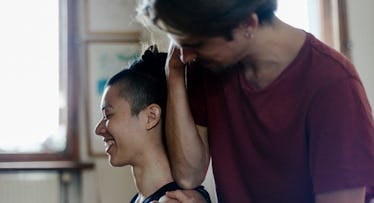 Man using elbow to massage woman