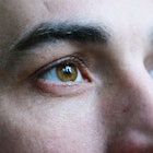Close up shot of man's brown eyes as he stares into the distance