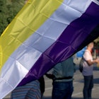 A yellow, white, and purple nonbinary pride flag.