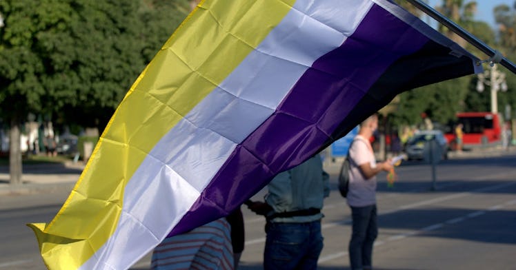 A yellow, white, and purple nonbinary pride flag.