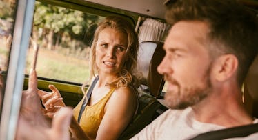 Woman in car looking shocked at something her husband said
