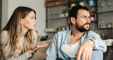 Man looking the other way as wife tries to talk to him