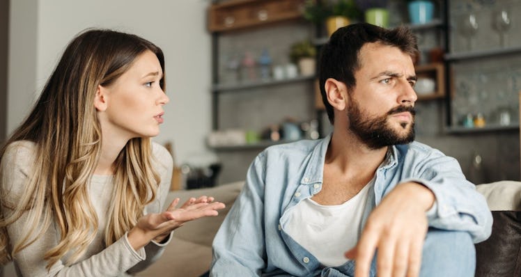 Man looking the other way as wife tries to talk to him