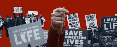 A hand holding up a cross necklace, with a background of anti-abortion protest signs.