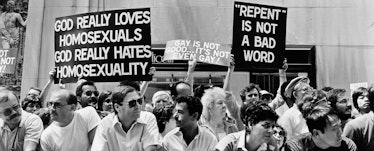 An old protest featuring homophobic, anti-gay protesters holding signs