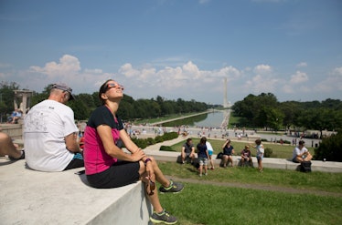 A woman looking up and watching the eclipse 