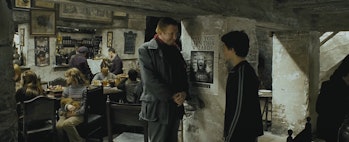 Harry Potter and Mr. Weasley talk about Sirius Black in the Leaky Cauldron in 'Harry Potter and the ...