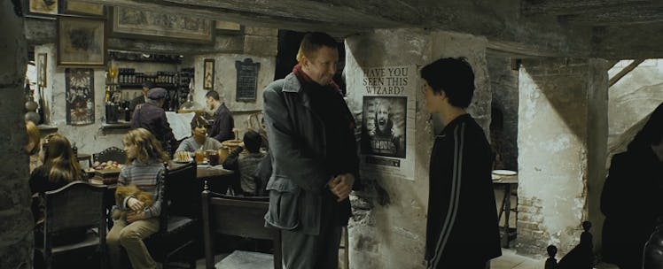 Harry Potter and Mr. Weasley talk about Sirius Black in the Leaky Cauldron in 'Harry Potter and the ...