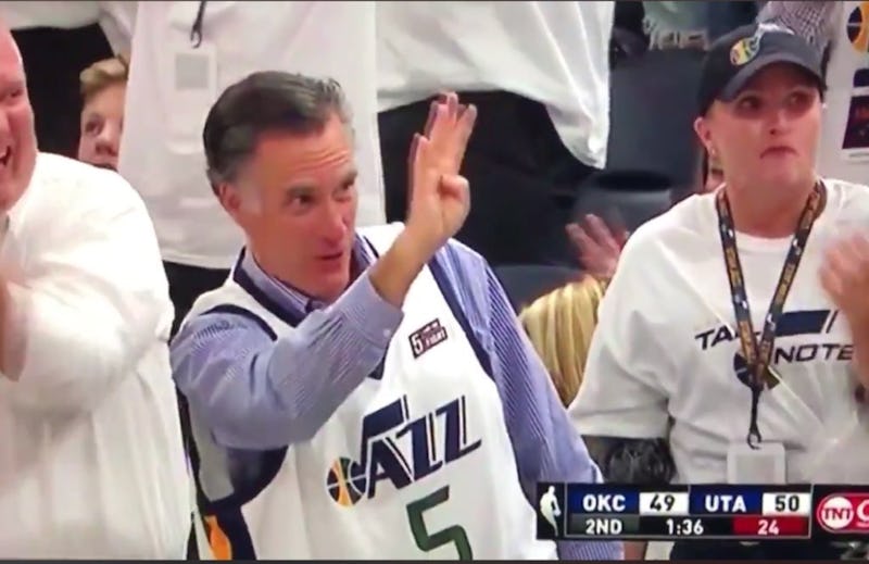 Mitt Romney waving to fans at the NBA playoffs