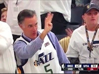 Mitt Romney waving to his audience before he became a meme after taunting player