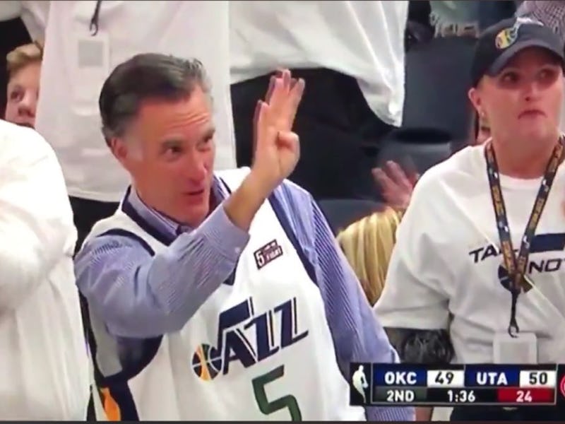 Mitt Romney waving to fans at the NBA playoffs