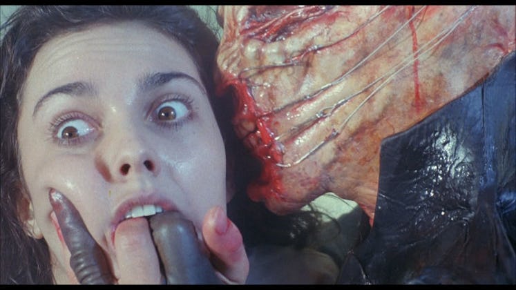 A female "Hellraiser" character with fingers in her mouth