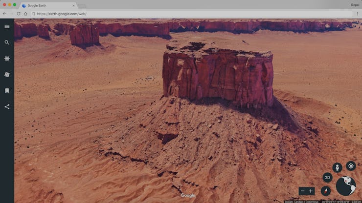 The new version of Google Earth displaying a satellite and street-level view of a desert landscape.