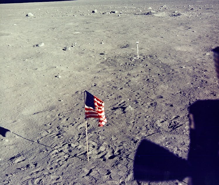 America flag and camera on the surface of the Moon