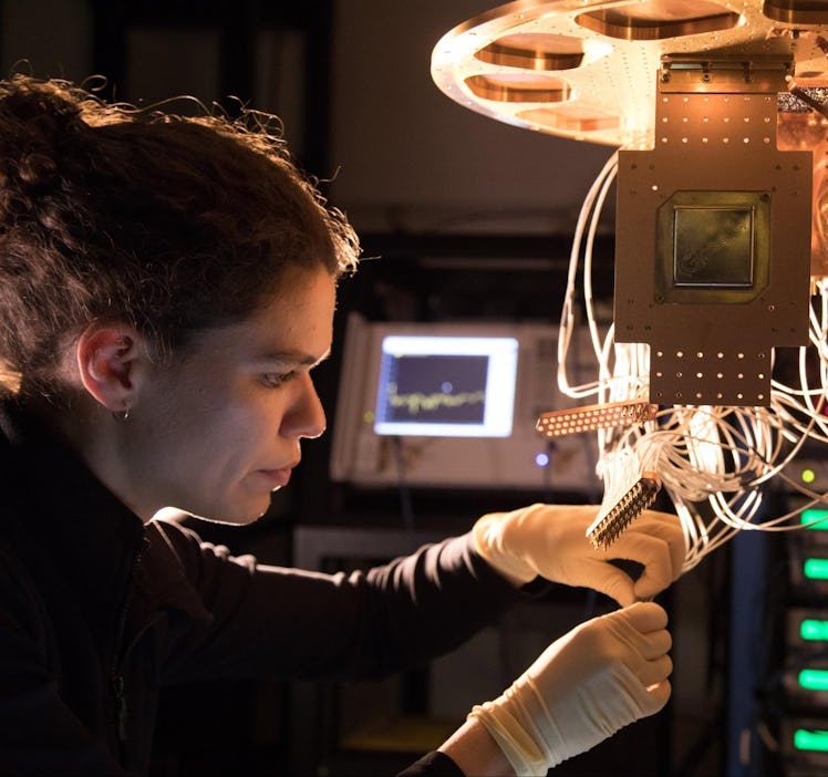A Bristlecone chip being installed by Research Scientist Marissa Giustina at the Quantum AI Lab in S...