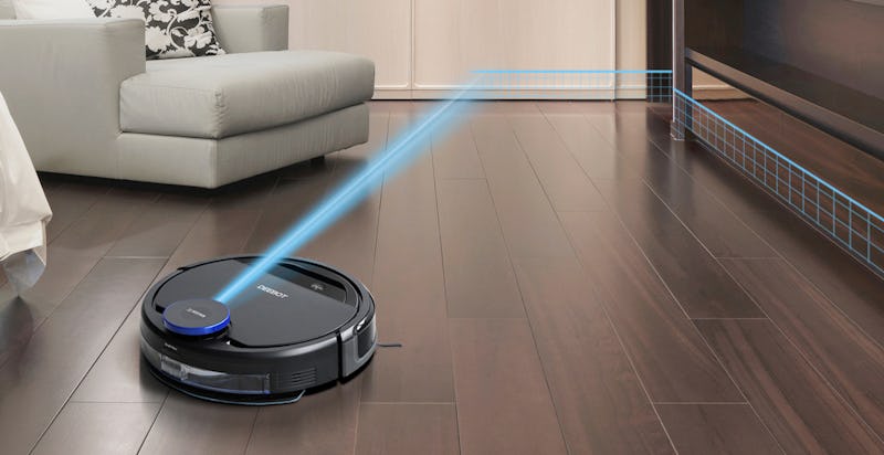 A black robot vacuum cleaner on floor