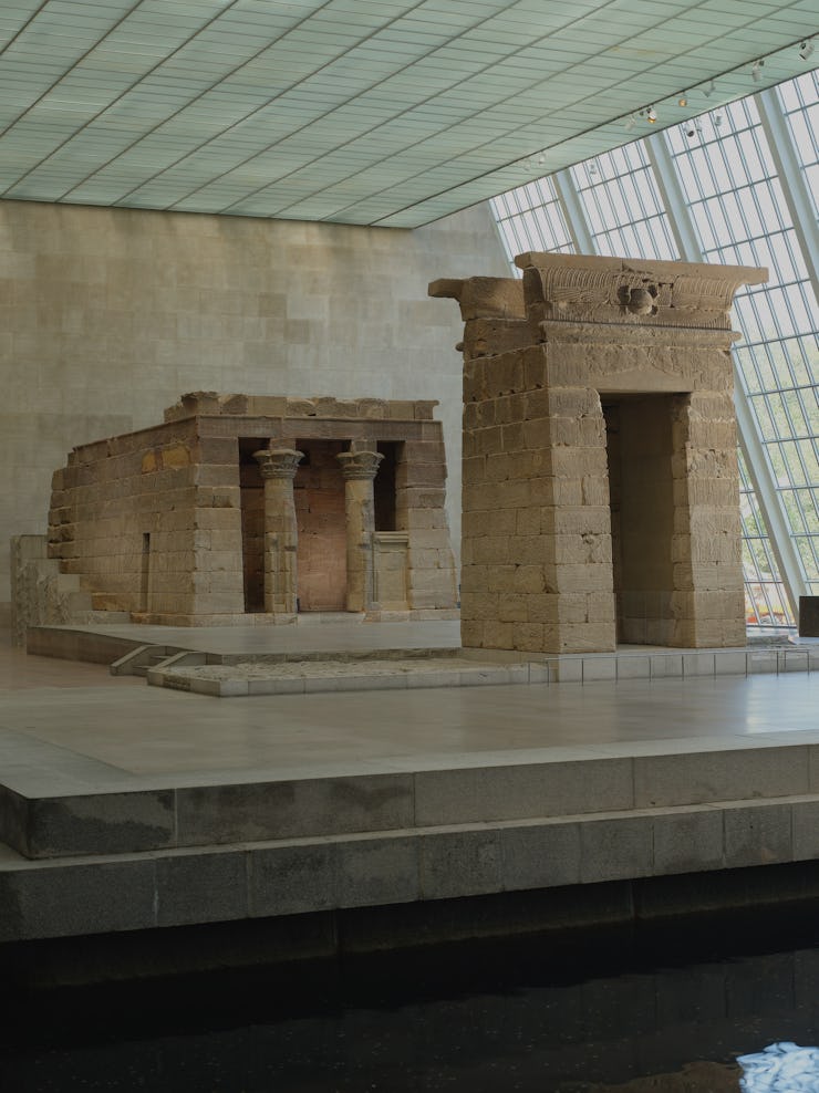 Two large architectural segment artifacts displayed in a museum