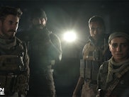 An insert from Call of Duty: Modern Warfare of four characters in the dark 