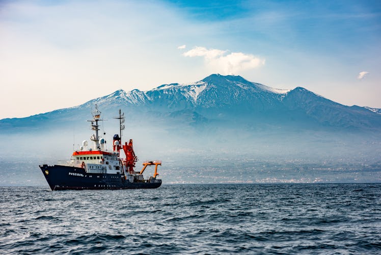 Research Vessel Poseidon deploys transponders across the seafloor at Mount Etna's flank to detect ch...