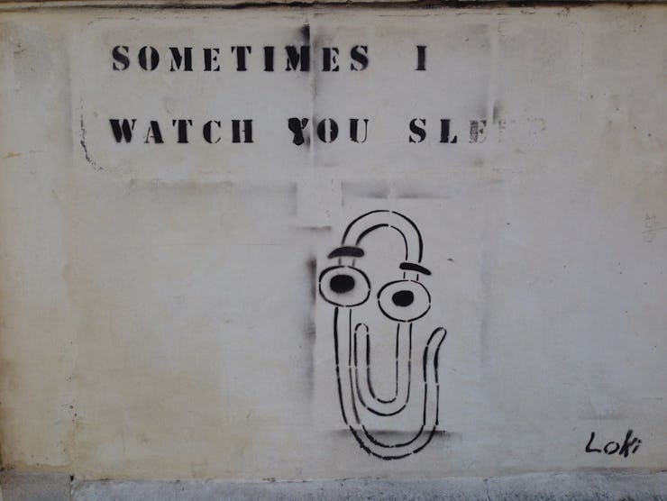 An illustration of Microsoft's Clippy character with a 'Sometimes I watch you' text