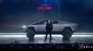 Elon Musk standing in front of a Tesla Cybertruck with a starting price of 39900 dollars