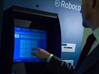 A man using a Roboco ATM