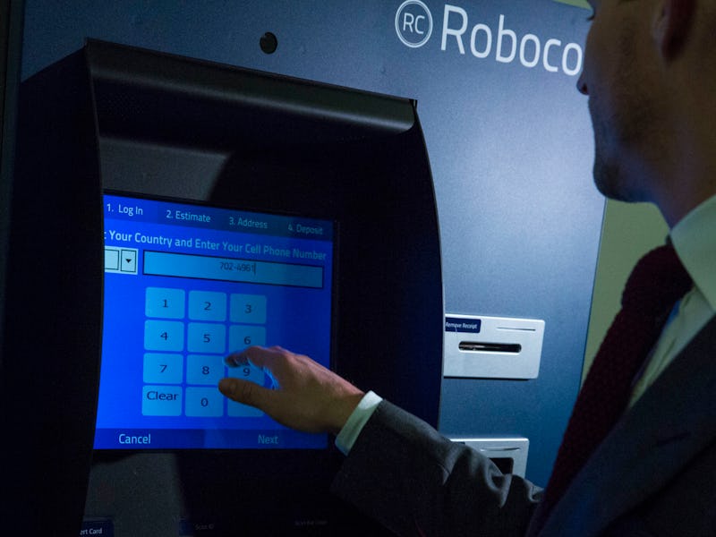 A man using a Roboco ATM