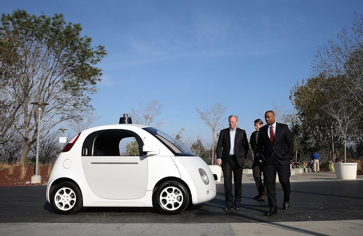 MOUNTAIN VIEW, CA - FEBRUARY 02: U.S. Transportation Secretary Anthony Foxx (R) and Google Chairman ...