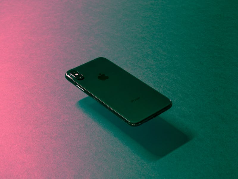 A floating 5G black iPhone