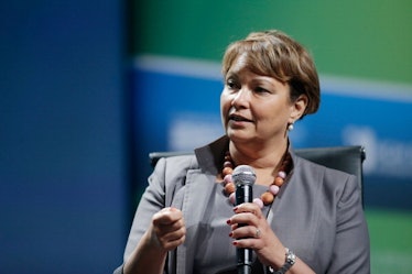 Lisa Jackson holding a microphone during her speech
