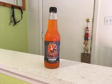 A bottle of the Wiz soda on the counter.