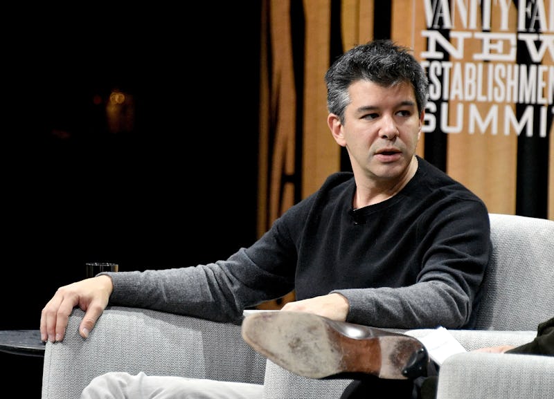 Uber CEO Travis Kalanick sitting in an armchair