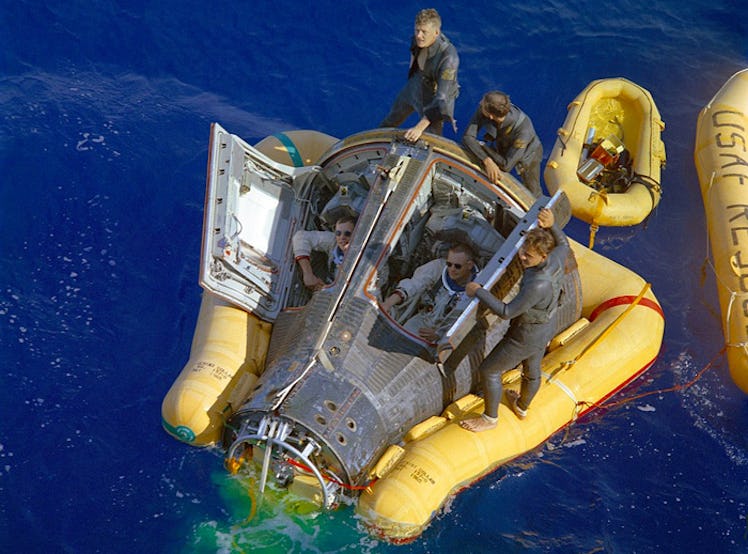 Recovery of Gemini 8 from the western Pacific Ocean; Armstrong sitting to the right