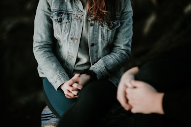 A woman sitting during a therapy session with a mental health professional