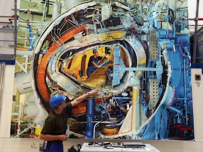 Engineers at the max planck institute adjusting the fusion reactor