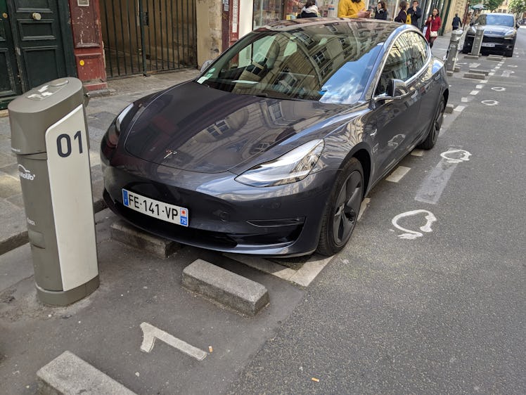 A Tesla Model 3 parked in an electric vehicle parking spot in Paris in April, 2019.