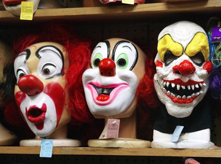 Clown masks on a shop shelf