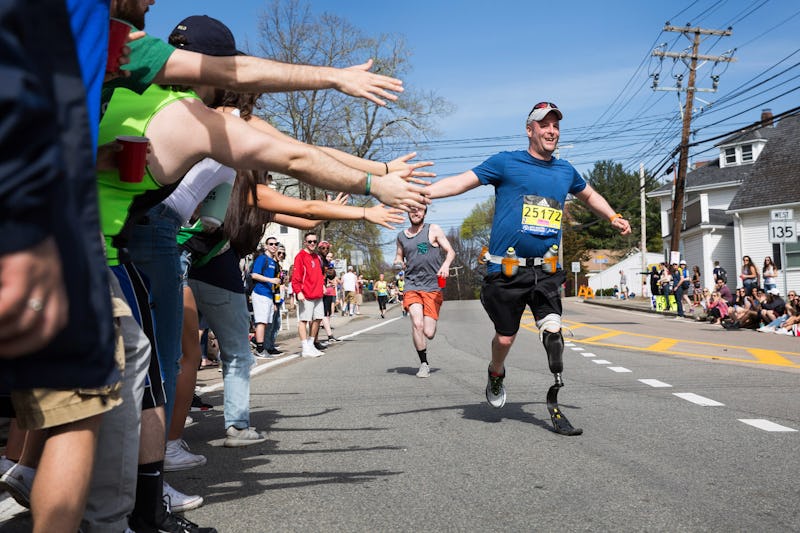 A man with a prosthetic leg at the finish line of the Boston Marathon 